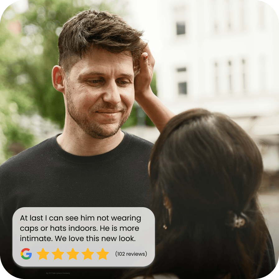 Man smiling confidently with successful hair restoration service done