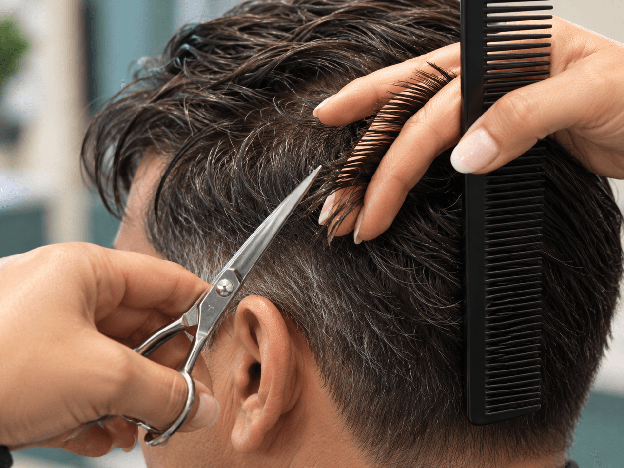 Scissors trimming a damp section to blend the hair system with the client’s side hair — AI-generated illustration